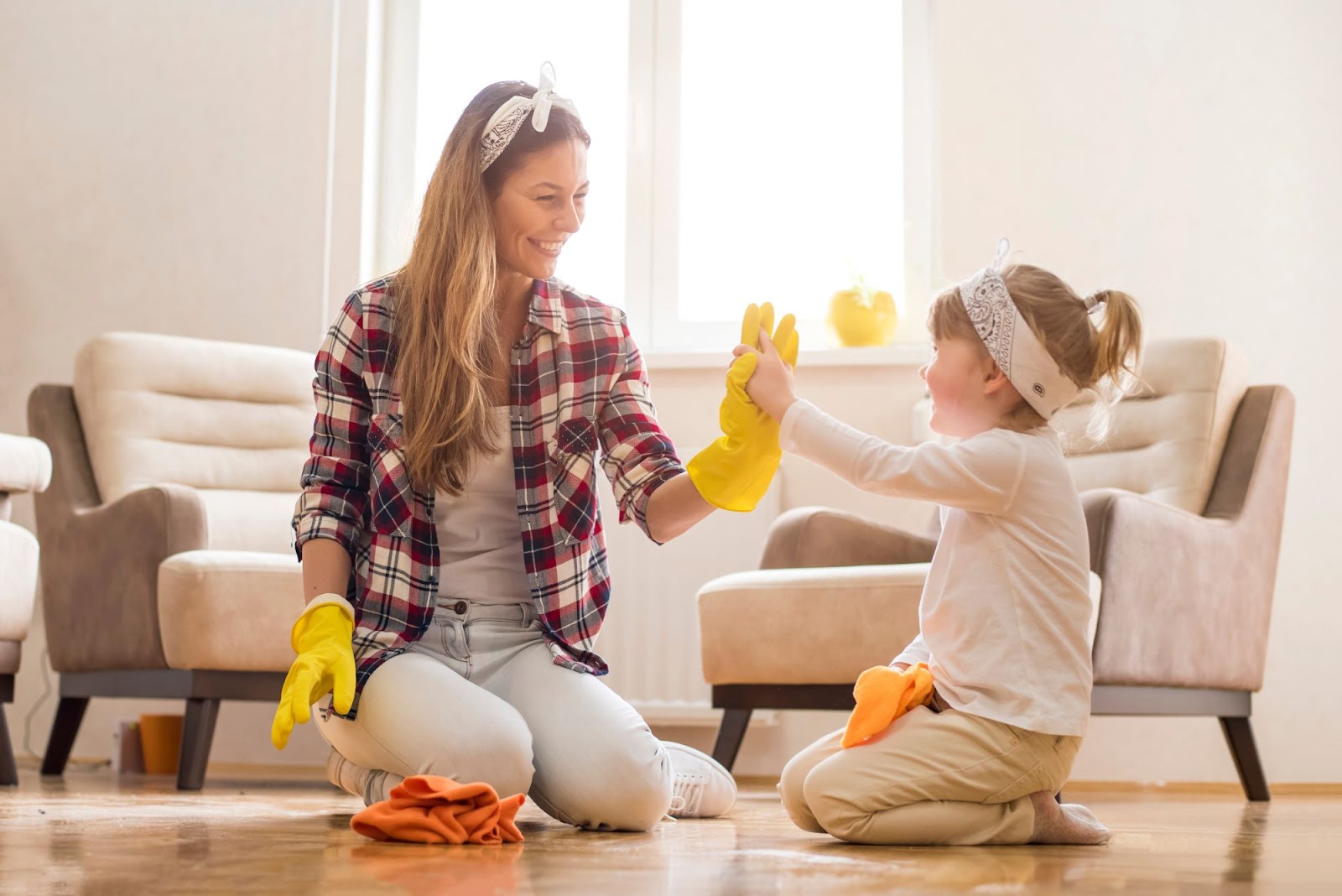Woman and her daughter cleaning. Woman and her daughter cleaning.